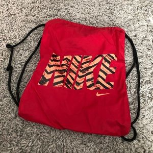 Nike drawstring bag with tiger stripe lettering
